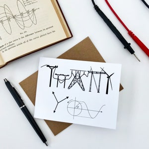 May include: A white card with black ink illustrations of electrical towers, wind turbines, and a sine wave graph. The word "THANK" is spelled out using the electrical towers.