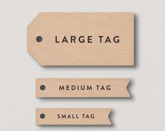 May include: Three light-colored wooden tags arranged vertically. The top tag is large with angled corners and the text LARGE TAG. The middle tag is medium with a pointed end and the text MEDIUM TAG. The bottom tag is small with the text SMALL TAG.