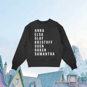 May include: Black sweatshirt with white text listing the names Anna, Elsa, Olaf, Kristoff, Sven, Oaken, and Samantha.