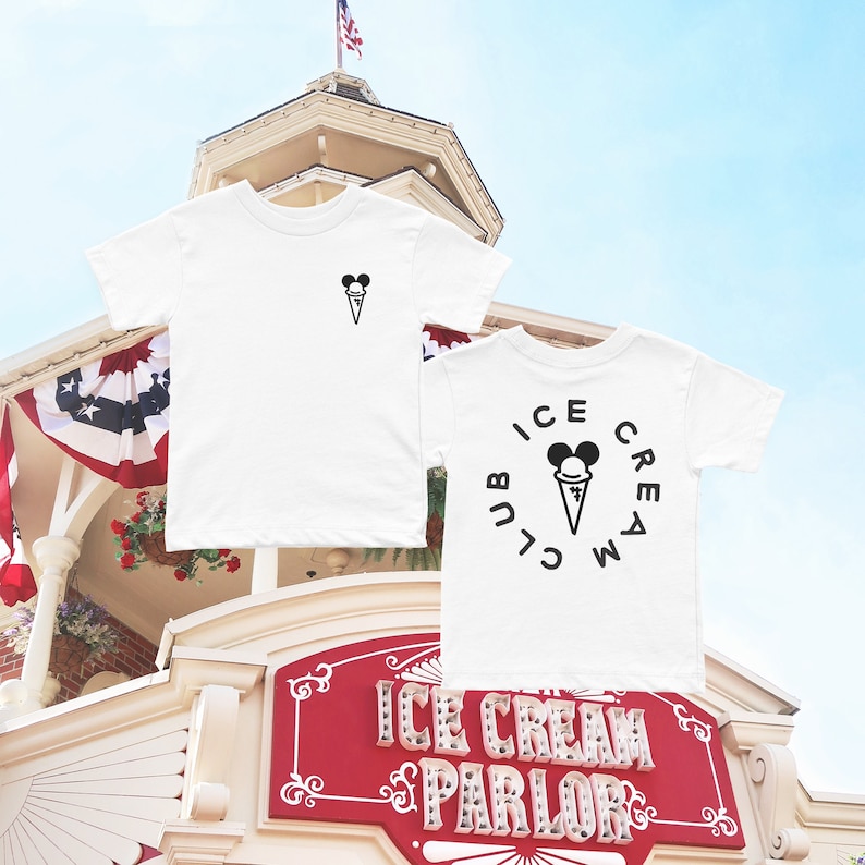 May include: Two white t-shirts featuring a black ice cream cone and Mickey Mouse ears graphic. One shirt has the graphic on the front and the other has the graphic on the back with the text "Ice Cream Club" around it.