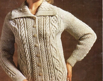May include: A cream-colored knitted cardigan with a cable knit pattern and a large collar. The cardigan has a button-up front and long sleeves.