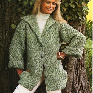 May include: A vintage knitting pattern cover with the name "Robin". The image shows a woman wearing a green knitted jacket with a hood. The text reads "DOUBLE DOUBLE to fit 81 to 107 cm bust". The number 2817 is in the top right corner.