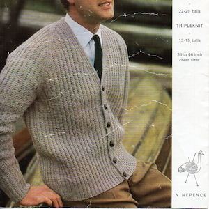 May include: A man wearing a light gray ribbed knit cardigan with dark buttons, a white collared shirt, and a dark tie. The image includes text that reads "Emu" and "Double Knitting". The chest sizes are 36 to 46 inches.