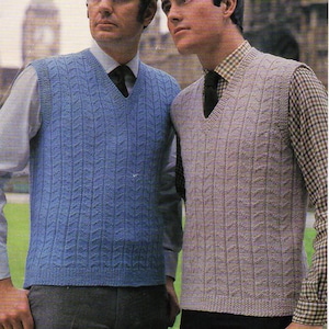 May include: Two men wearing knitted vests. The vest on the left is blue and the vest on the right is gray. The text on the image reads "Wendy Double Knit or 4 Ply... 40/44" Chest 737".