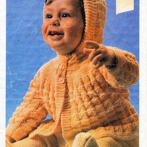 May include: A knitted hooded coat and leggings set for a baby in a pale yellow colour. The set is made with a textured stitch pattern. The pattern number is 759 and the yarn is 8 ply.