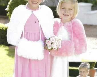 May include: Two girls wearing pink and white fuzzy knit capes. The girl on the left is wearing a pink dress with white flowers and holding a white fuzzy bag. The girl on the right is wearing a white dress and holding a bouquet of pink roses. The text on the page reads "Funky Fur/Snuggly DK 2108 56-71cm 22-28"