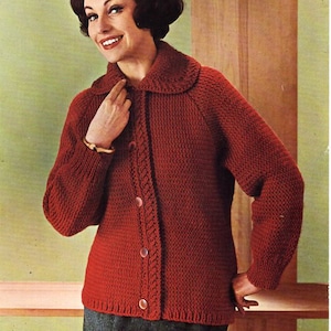 May include: A red knitted cardigan with a white collar and button closure. The cardigan has a cable knit pattern and is shown on a model with a bust size of 38-42 inches.