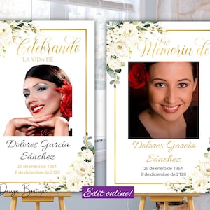 Könnte beinhalten: Zwei weiße Fotobox-Schilder mit goldenen Rahmen und weißen floralen Akzenten. Die Schilder zeigen "Celebrando la vida de Dolores Garcia Sanchez" und "En memoria de Dolores Garcia Sanchez" mit Geburts- und Todesdaten.