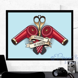 May include: A vintage-style illustration of a pair of hair dryers and scissors crossed over each other. The hair dryers are red and the scissors are gold. A banner reads "Weapons of Choice".