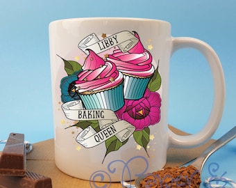 May include: White ceramic mug with a pink and blue cupcake design and the text "Libby Baking Queen".