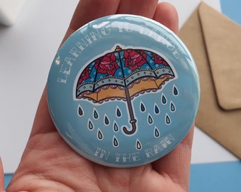 Insignia de botón "Bailar bajo la lluvia", diseño de paraguas, regalo positivo