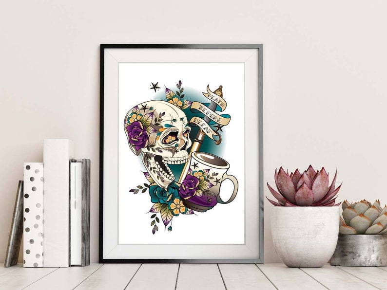 May include: A colorful illustration of a skull with flowers and a coffee cup. The skull has a toothy grin and is surrounded by purple, blue, and yellow flowers. The coffee cup is filled with coffee and has a floral design. The text "Death Before Decaf" is written on a banner above the skull.