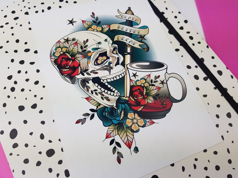 May include: A colorful tattoo-style illustration of a skull with a dagger and a coffee mug. The skull is surrounded by flowers and the dagger has a banner that reads "Death Before Decaf".