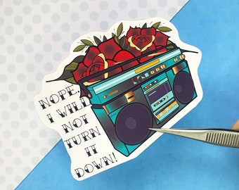 May include: A sticker with a blue and black boombox with red roses on top. The sticker has the text "NOPE. I WILL NOT TURN IT DOWN!"