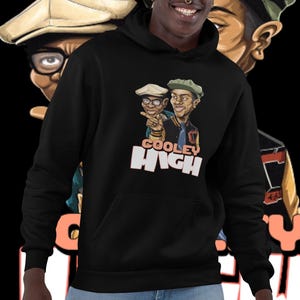 May include: Black hoodie with a graphic print of two cartoon characters wearing hats and the text "Cooley High".