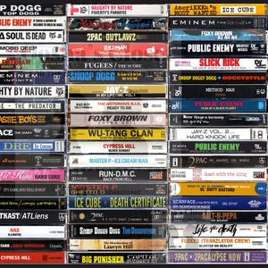 May include: A collection of vintage cassette tapes featuring various hip hop artists, including Snoop Dogg, Public Enemy, Ice Cube, and 2Pac. The tapes are arranged in rows and are all in their original packaging.
