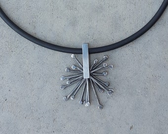 Kinetic oxidized silver pendant