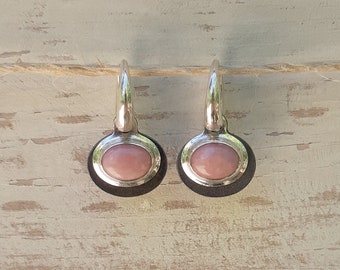 Two-tone sterling silver drop earrings inset with pink opal gemstone.