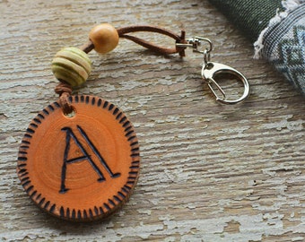 Pyrographed personalized initials wooden keychain.