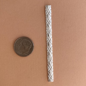 May include: A silver metal chain link with a diamond pattern. The chain is about 2 inches long.