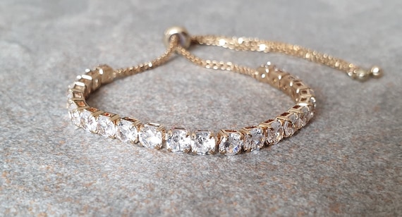 Tennis bracelet. Gold Swarovski crystal tennis bracelet. Bridal bracelet. Crystal line adjustable bracelet. Tennis bracelet. Gold Swarovski crystal tennis bracelet. Bridal bracelet. Crystal line adjustable bracelet.