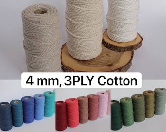May include: Spools of 4 mm, 3-ply cotton rope in various colors. The image shows several large spools of natural and off-white rope, along with smaller spools in shades of blue, red, and green. The text "4 mm, 3PLY Cotton" is visible.