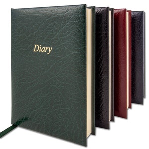 May include: A set of five leather-bound diaries in different colours, including green, black, burgundy, and navy. The green diary has the word "Diary" embossed in gold on the front cover.