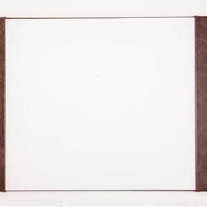 May include: A white rectangular frame with a brown leather border on each side.