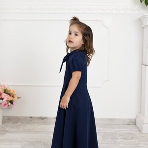 Navy blue mother daughter matching dresses. Chic mommy and me outfits with bow and pockets. Family look formal clothing image 3