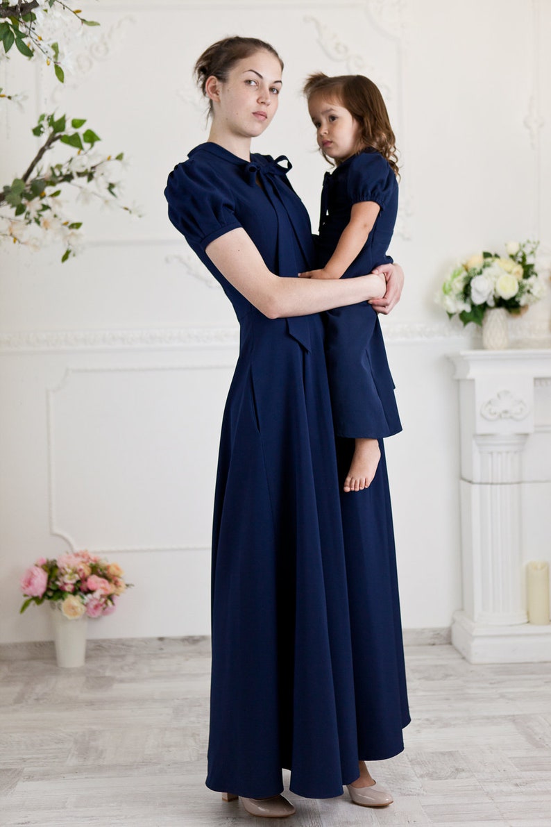 Navy blue mother daughter matching dresses. Chic mommy and me outfits with bow and pockets. Family look formal clothing image 1