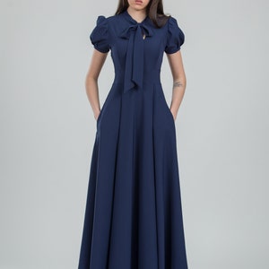 Navy blue mother daughter matching dresses. Chic mommy and me outfits with bow and pockets. Family look formal clothing image 5