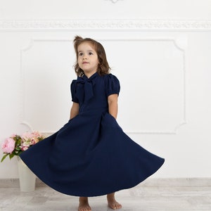 Navy blue mother daughter matching dresses. Chic mommy and me outfits with bow and pockets. Family look formal clothing image 2