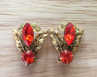 Vintage costume jewelry earring set.  red and yellow rhinestones with bronze leaves.