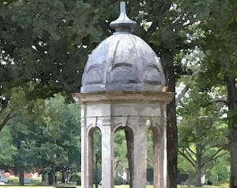 May include: A white and gray gazebo with a domed roof stands in a park setting. The gazebo has arched openings and is surrounded by green grass and trees. The sky is overcast.