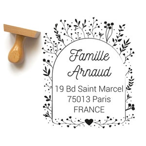 May include: Black and white stamp with a floral border and the text "Famille Arnaud" with an address: 19 Bd Saint Marcel 75013 Paris FRANCE.