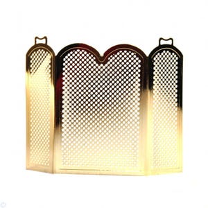 May include: A gold-colored, folding fireplace screen with a perforated design. The screen has three panels, each with a series of small, evenly spaced holes. The top of each panel has a decorative handle.