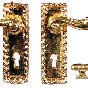 May include: Miniature gold-colored door hardware set, including two door handles and a key. The handles have ornate detailing and a keyhole. The key is small and has a simple design. The set is likely for a dollhouse or other small-scale project.