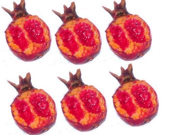 May include: Six halved pomegranates, showcasing vibrant red seeds and a yellow-orange rind. The fruits are arranged against a white background, highlighting their fresh, juicy appearance. The image captures the natural beauty of the pomegranates.