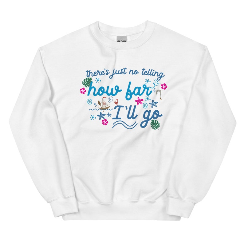 May include: White sweatshirt with the text "there's just no telling how far I'll go" in blue and green. The design includes tropical elements like flowers, waves, and a boat. A casual, comfortable garment.