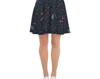 May include: A black skater skirt with a red waistband. The skirt features a repeating pattern of stars, spaceships, and lightsabers.