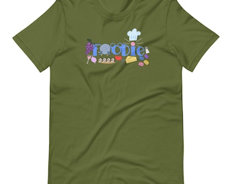 Camiseta unisex de manga corta con estampado de Remy Ratatouille y temática gastronómica del Festival de Comida y Vino.