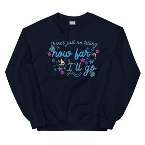 May include: Navy blue sweatshirt with the text "there's just no telling how far I'll go" in light blue script. The design includes illustrations of a sailboat, starfish, and tropical flowers in pink and green.