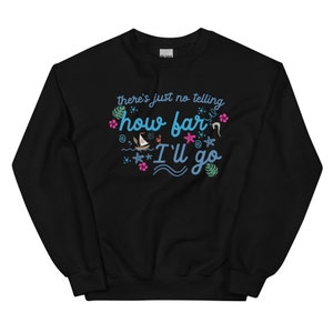 May include: Black sweatshirt with the text "there's just no telling how far I'll go" in blue script. The design includes a sailboat, starfish, and tropical flowers in pink and green.