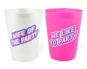 May include: Two plastic cups, one white and one bright pink. The white cup has the text "WIFE OF THE PARTY" in blue and pink lettering. The pink cup has the text "WE LIKE TO PARTY" in purple and pink lettering.