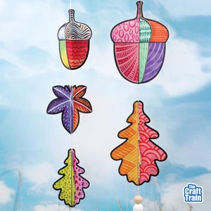May include: A hanging mobile featuring two paper acorns and three paper leaves with intricate, colorful patterns in shades of pink, orange, purple, yellow, and green. The text The Craft Train is visible in the bottom right corner.