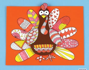 May include: A colorful paper craft turkey with a brown body and a red, yellow, and white patterned tail. The turkey has a red wattle and a yellow beak.