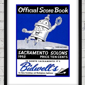 May include: A vintage blue and white baseball scorebook featuring a cartoon mascot of a can with a smiling face and arms and legs. The text on the scorebook reads "Official Score Book", "Sacramento Solons", "1952", "Price Ten Cents", "In North Sacramento It's Bidwell's", and "For Home Furnishings and Westinghouse Appliances".