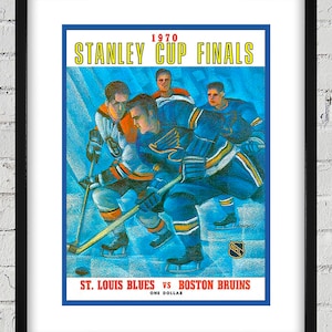 May include: A vintage-style poster for the 1970 Stanley Cup Finals featuring a blue and yellow color scheme. The poster depicts a hockey game between the St. Louis Blues and the Boston Bruins. The text on the poster reads "1970 Stanley Cup Finals, St. Louis Blues vs Boston Bruins, One Dollar."