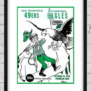 Può includere: Un'illustrazione a fumetti in bianco e nero di un uomo con un asino e un'aquila. L'uomo indossa una camicia e un cappello verdi. L'aquila vola sopra l'uomo e l'asino. Il testo sull'immagine recita "San Francisco 49ers" e "Philadelphia Eagles". Il testo recita anche "October 19, 1958 Franklin Field 50¢ Official Program".