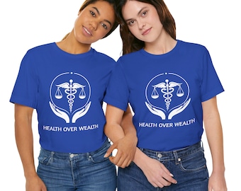 May include: Two people wearing royal blue t-shirts with a white graphic of a caduceus symbol and the text "HEALTH OVER WEALTH".
